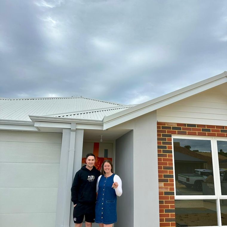 House of Boss clients receiving the keys to their new home.