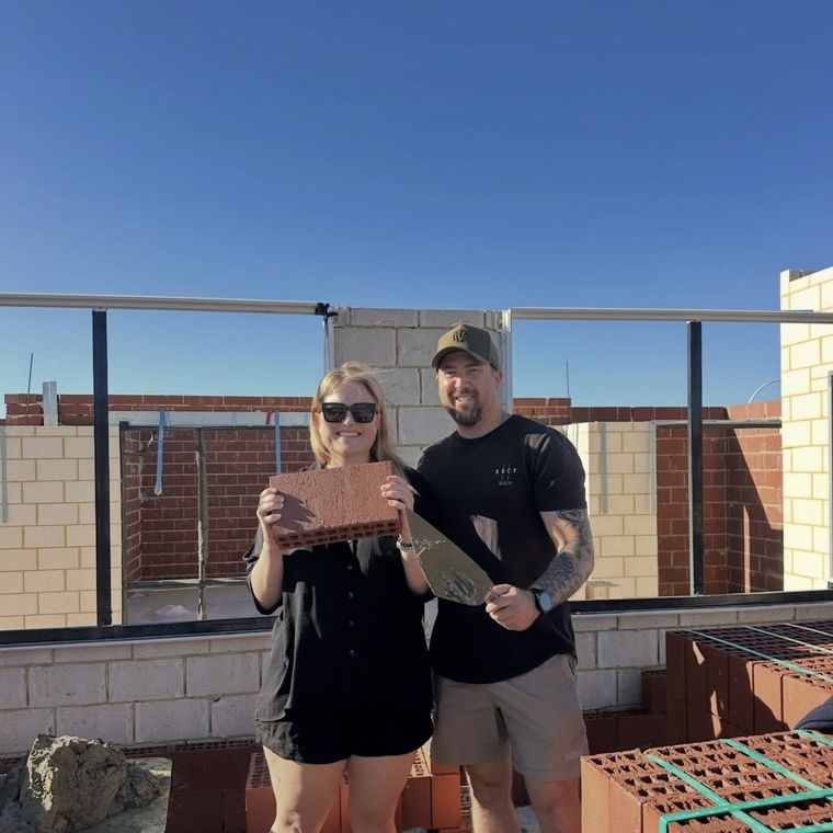 House of Boss clients at their block as the bricks go up.