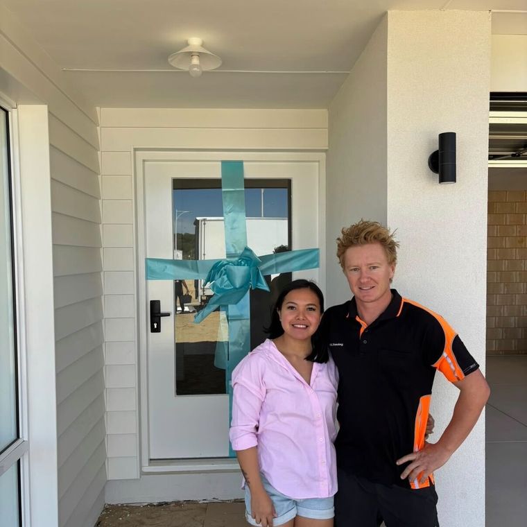 House of Boss clients smiling on handover day.